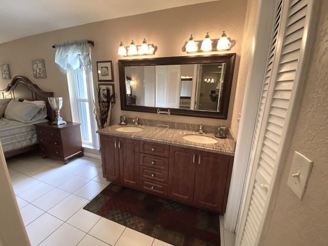 bathroom with tile patterned flooring and vanity