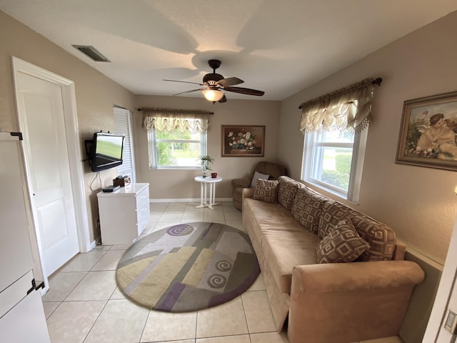 living room with light tile patterned floors and ceiling fan