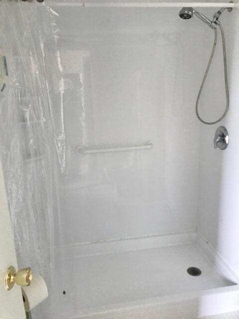 bathroom with a shower with shower curtain