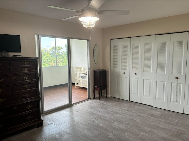 unfurnished bedroom with ceiling fan, a closet, access to outside, and light hardwood / wood-style floors