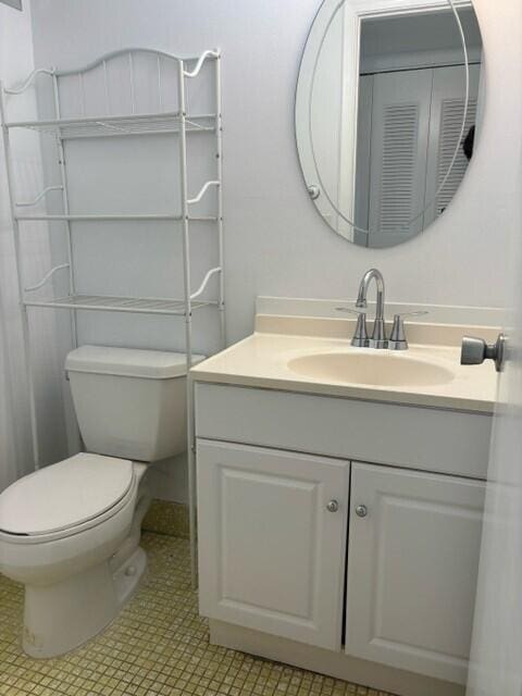 bathroom with vanity and toilet