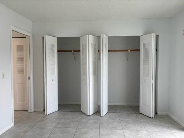 unfurnished bedroom with two closets