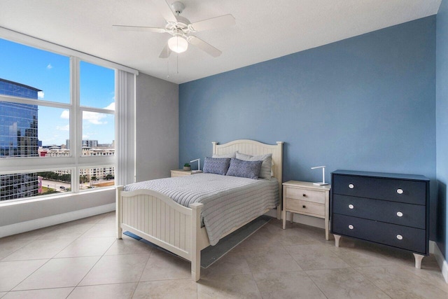 tiled bedroom with ceiling fan