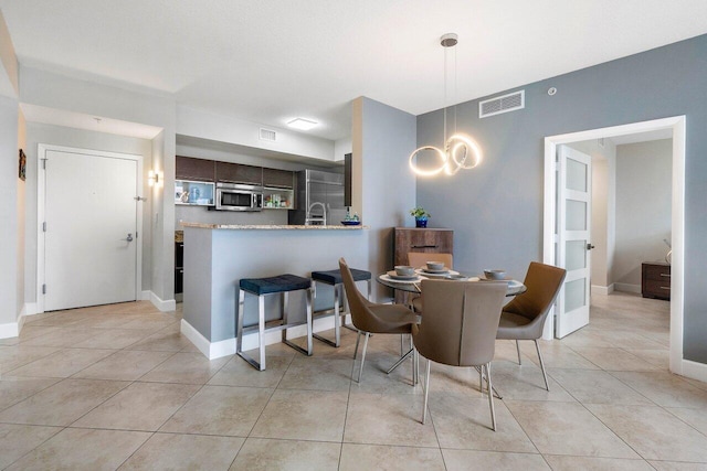 view of tiled dining space