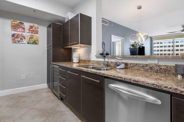 kitchen with dishwasher, pendant lighting, dark brown cabinetry, and sink