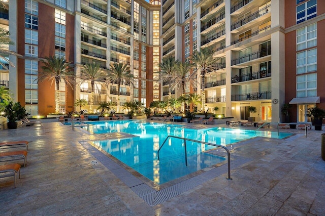 view of swimming pool featuring a patio area