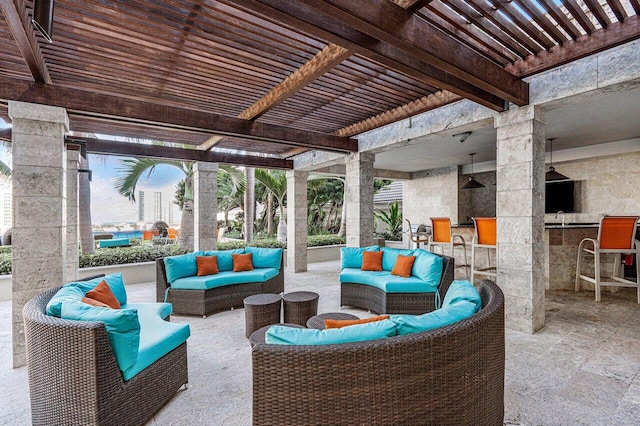 view of patio / terrace featuring an outdoor living space, a wet bar, and a pergola