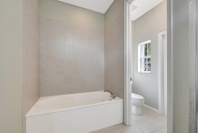 bathroom with toilet, tile patterned flooring, and a washtub