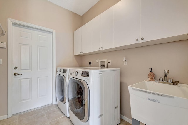 6716 Eagle Ridge Dr, Greenacres, FL 33413 - laundry room with baseboards, light tile patterned flooring, cabinet space, a sink, and washer and clothes dryer
