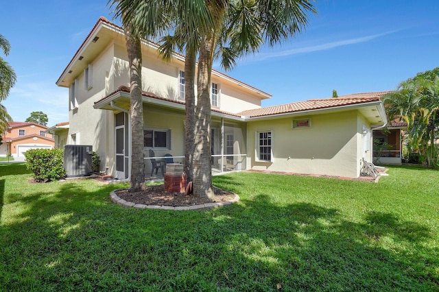 6716 Eagle Ridge Dr, Greenacres, FL 33413 - rear view of property featuring stucco siding, a lawn, central AC unit, and a tile roof