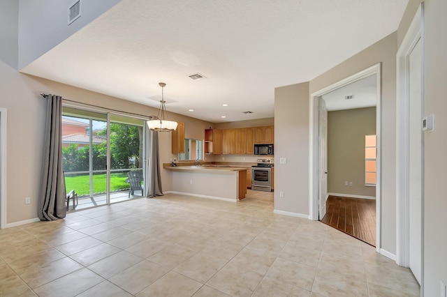 6716 Eagle Ridge Dr, Greenacres, FL 33413 - kitchen featuring stainless steel electric range oven, visible vents, black microwave, and an inviting chandelier