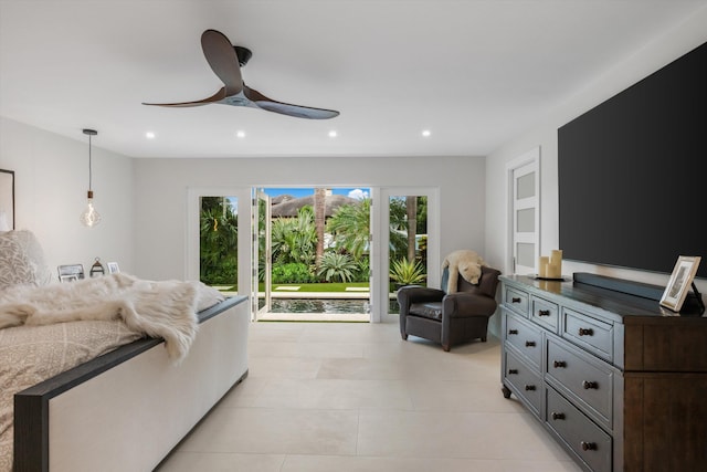 bedroom with ceiling fan and access to exterior