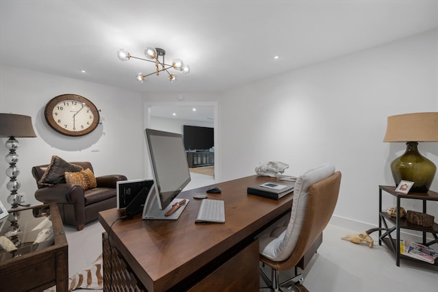 home office featuring an inviting chandelier