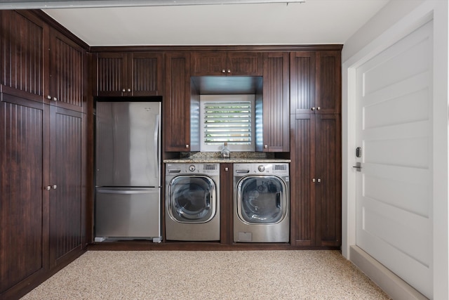 laundry area featuring washing machine and clothes dryer