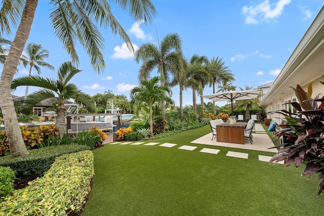 view of yard with a patio and a hot tub