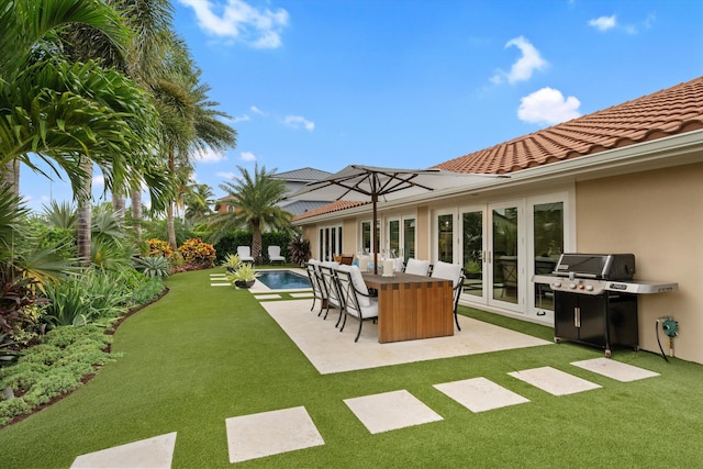 view of yard with french doors and a patio area