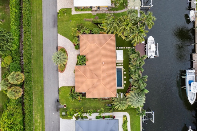 birds eye view of property featuring a water view