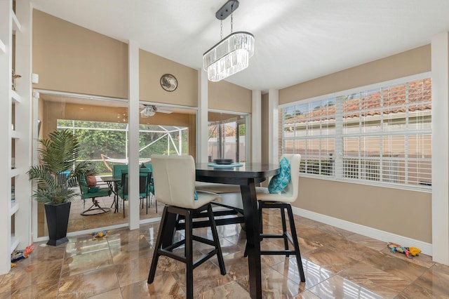 dining room with a wealth of natural light and lofted ceiling