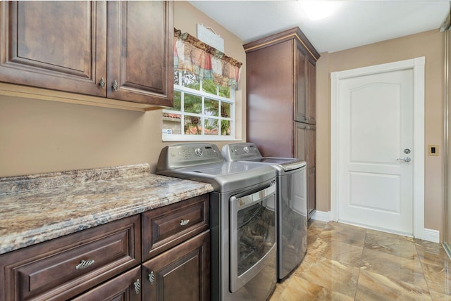 laundry area with cabinets and independent washer and dryer