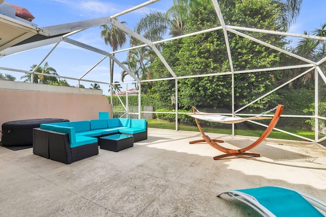 view of patio with glass enclosure and outdoor lounge area