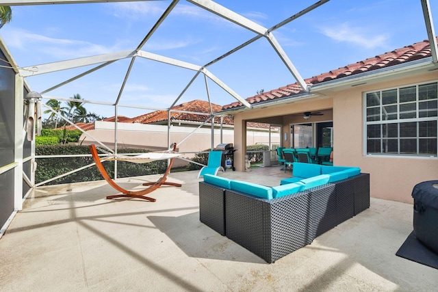 view of patio / terrace featuring ceiling fan, outdoor lounge area, and a lanai