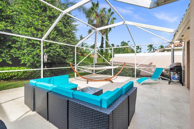 view of patio / terrace with a grill and glass enclosure