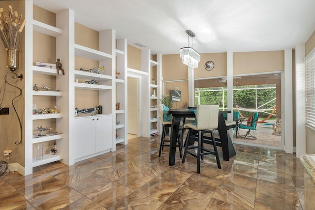 dining room with built in shelves