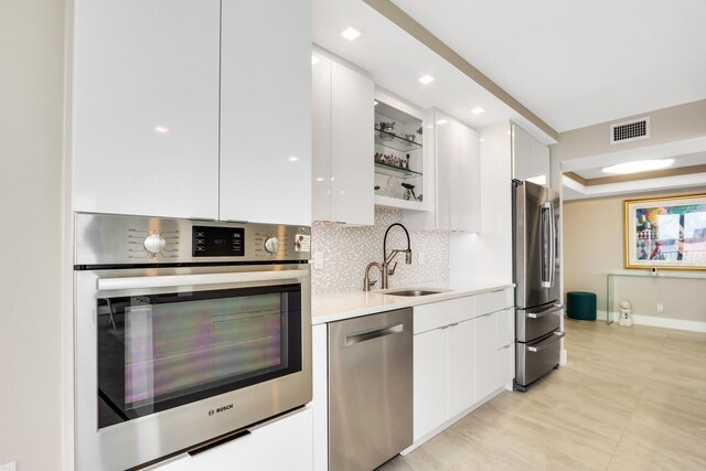 tiled dining space featuring plenty of natural light, a water view, and floor to ceiling windows