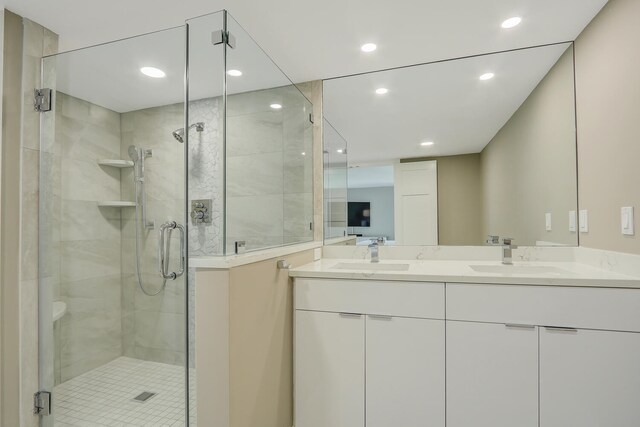 bathroom featuring vanity and an enclosed shower