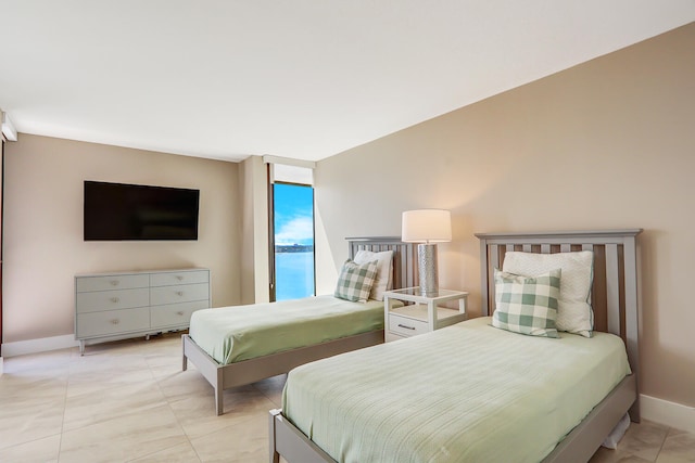 bedroom featuring light tile patterned floors