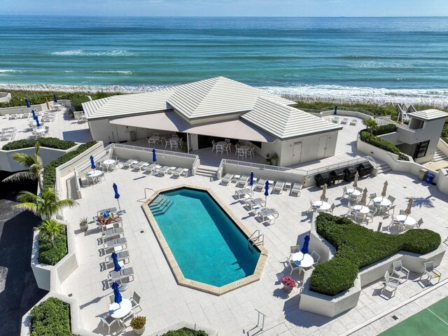 bird's eye view featuring a water view and a view of the beach