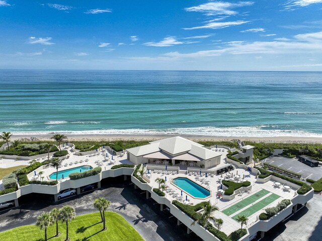 bird's eye view with a view of the beach and a water view