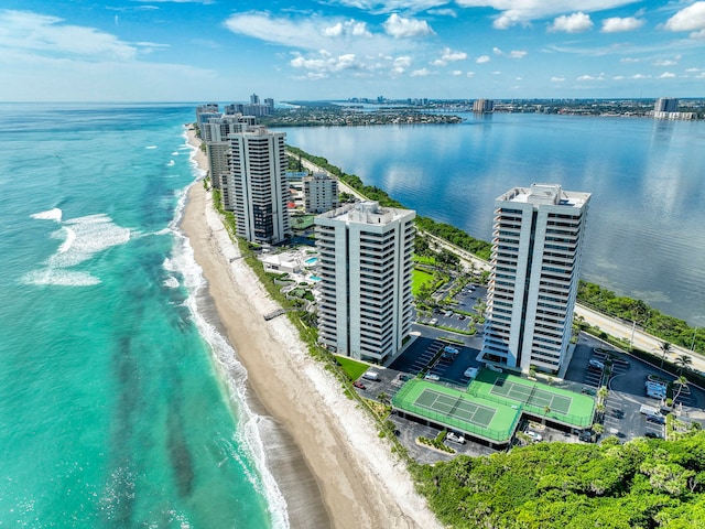 bird's eye view featuring a water view and a view of the beach