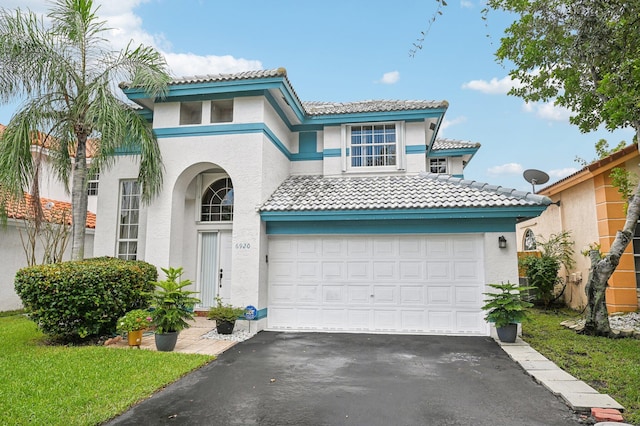 mediterranean / spanish-style house featuring a garage