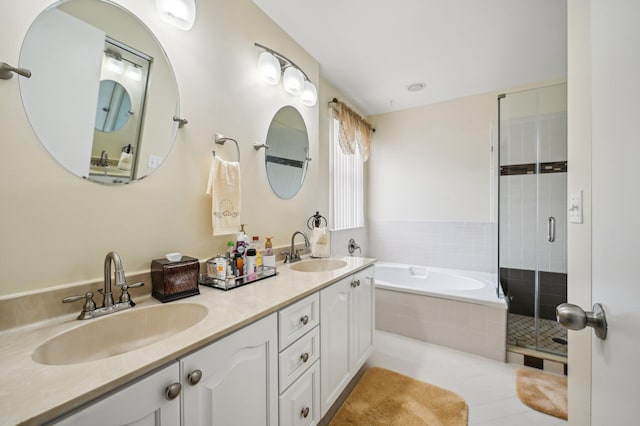 bathroom with tile patterned flooring, vanity, and shower with separate bathtub