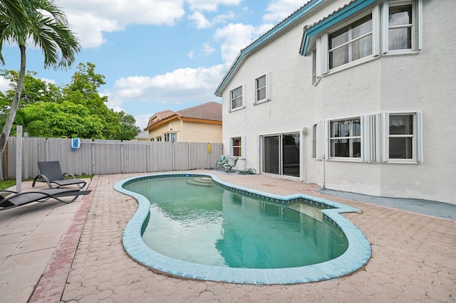 view of pool featuring a patio