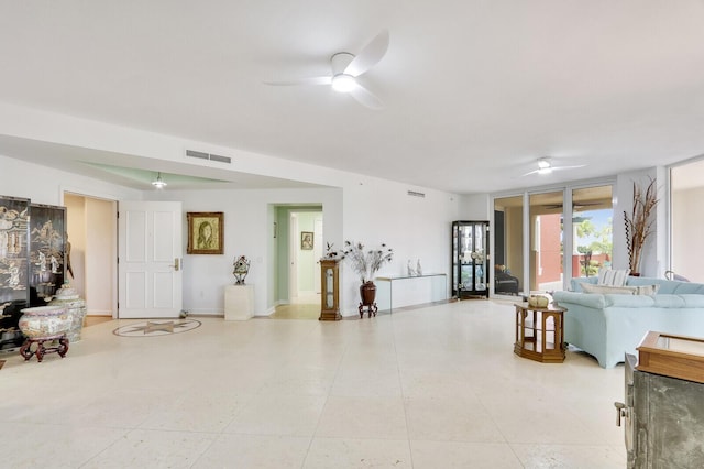 interior space with a ceiling fan and visible vents