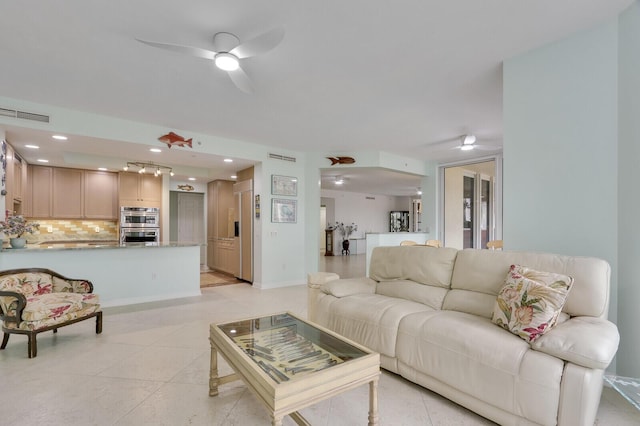living room with recessed lighting, a ceiling fan, visible vents, and light tile patterned floors