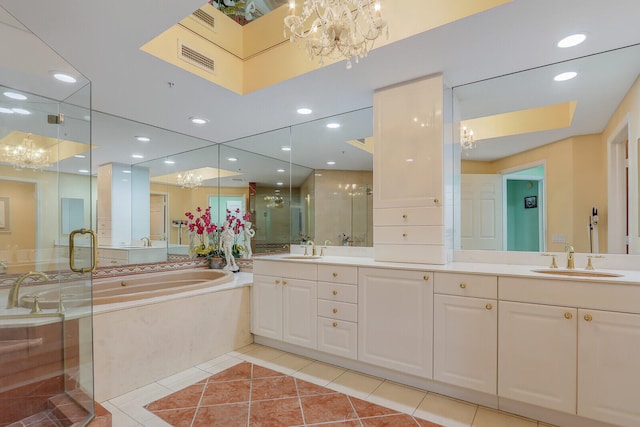 bathroom featuring vanity, a notable chandelier, tile patterned floors, and separate shower and tub