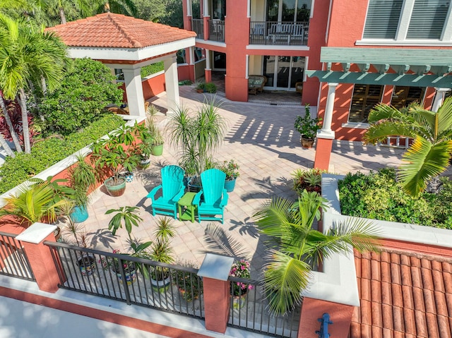 view of patio featuring a balcony