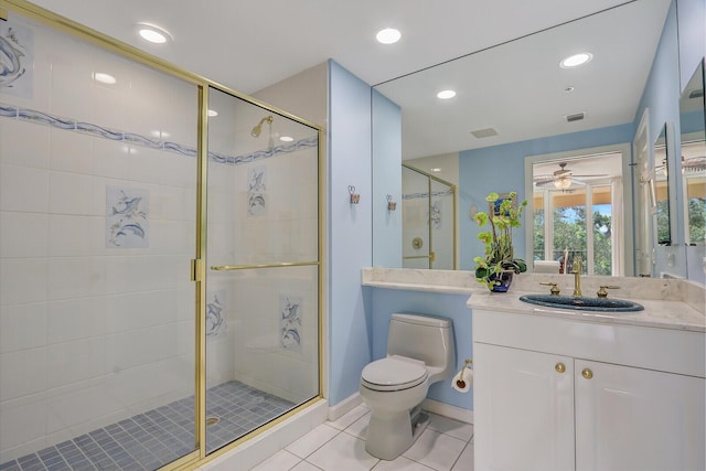 full bathroom featuring tile patterned flooring, a shower stall, toilet, and vanity