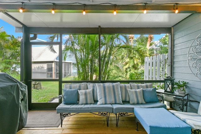 sunroom / solarium with track lighting