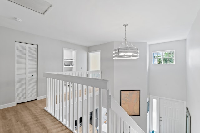 hallway featuring a chandelier