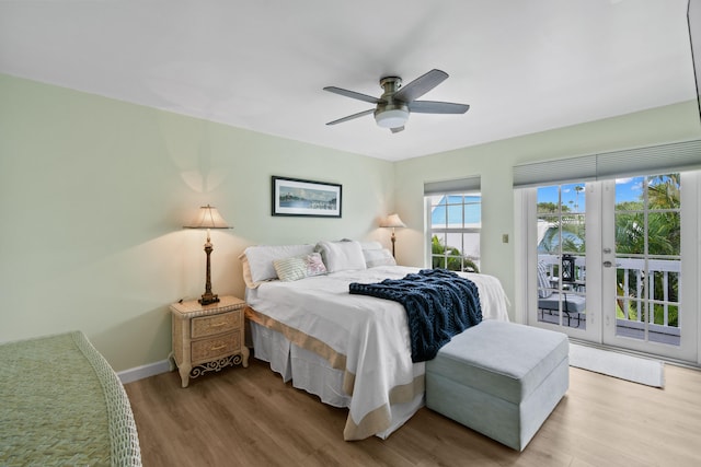 bedroom with ceiling fan, hardwood / wood-style flooring, and access to exterior