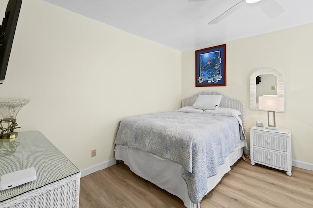 bedroom featuring ceiling fan and light hardwood / wood-style flooring