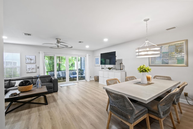 dining space featuring light hardwood / wood-style floors and ceiling fan