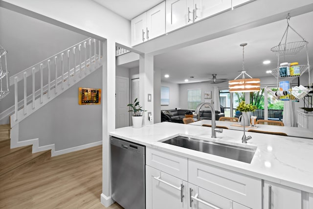 kitchen featuring light hardwood / wood-style floors, white cabinetry, dishwasher, ceiling fan, and sink