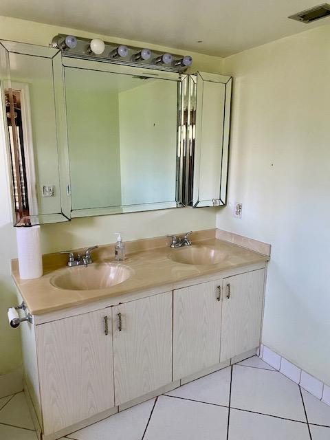 bathroom with vanity and tile patterned flooring