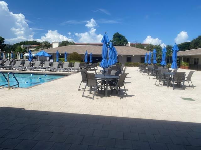 view of swimming pool featuring a patio area