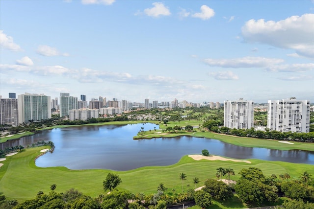 view of water feature with golf course view and a city view